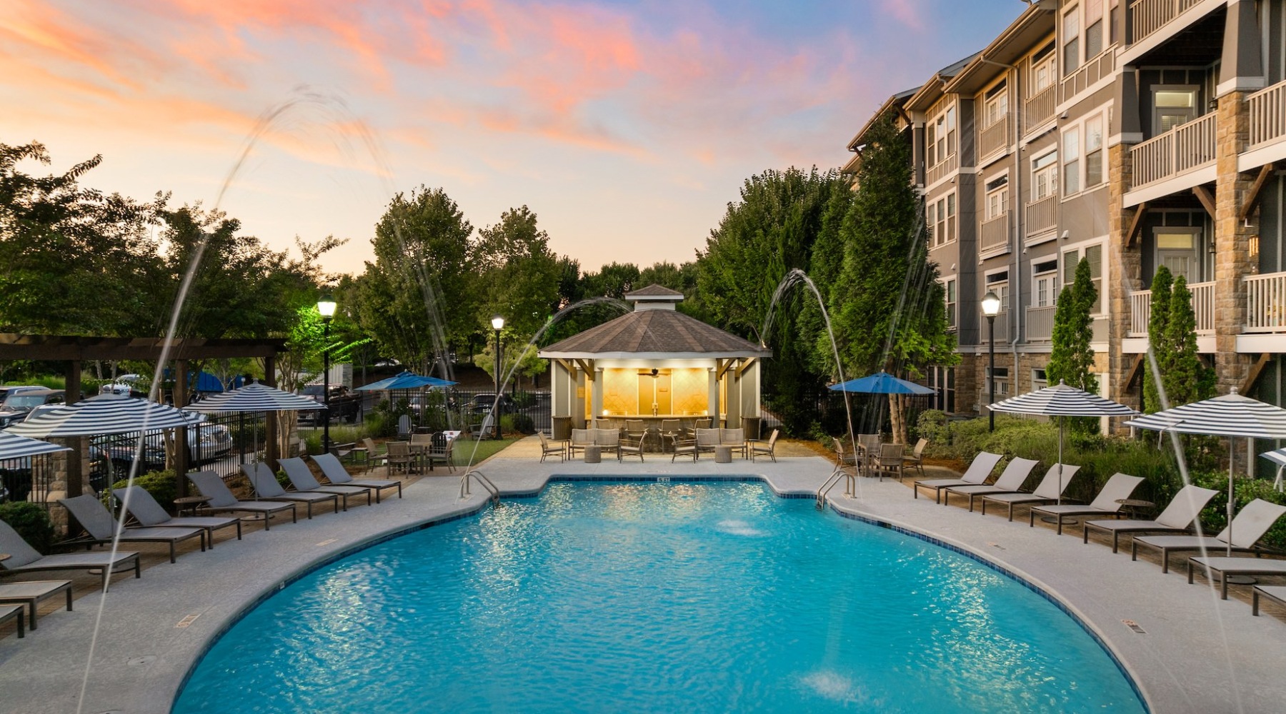 Find your perfect fit at The Regency at Johns Creek Walk resort style swimming pool with fountains