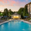 resort style swimming pool with fountains
